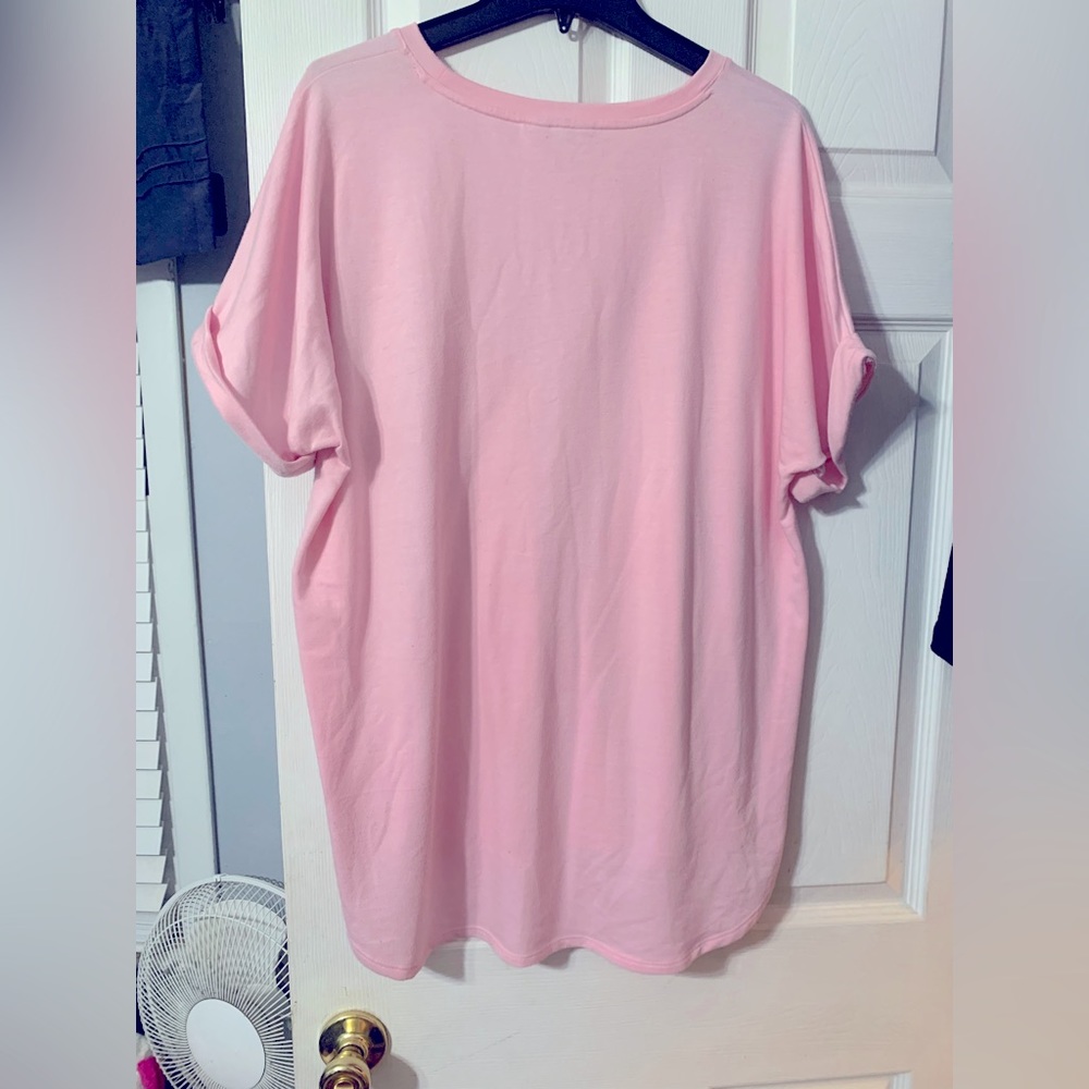 Causal dressy soft light pink blouse. Never dried. Soft to the touch. Like new.